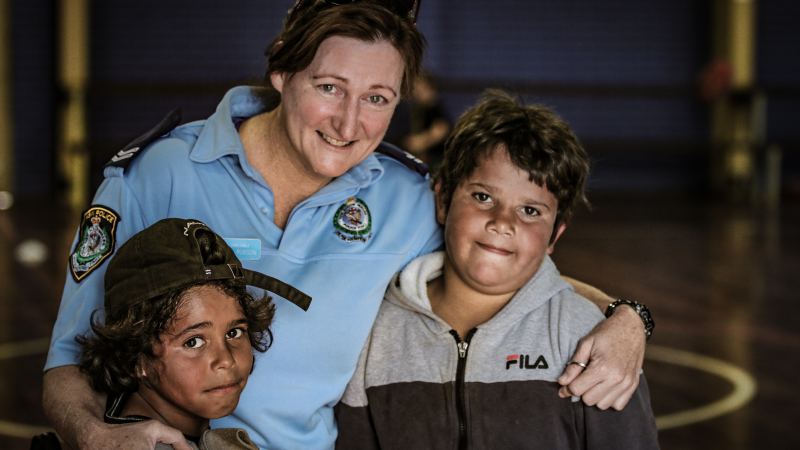 Moree homepage image 1 PCYC Moree police offier with kids