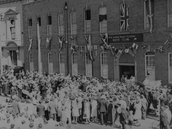 Old photo of people outside of a Boy's Club