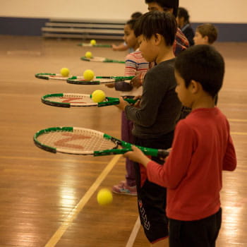 kids doing tennis drill