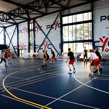 teenages playing basketball