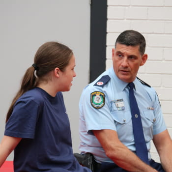 police officer talking to a young girl