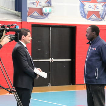 basketball team coach getting interviewed