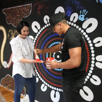guy paiting a hand of a lady