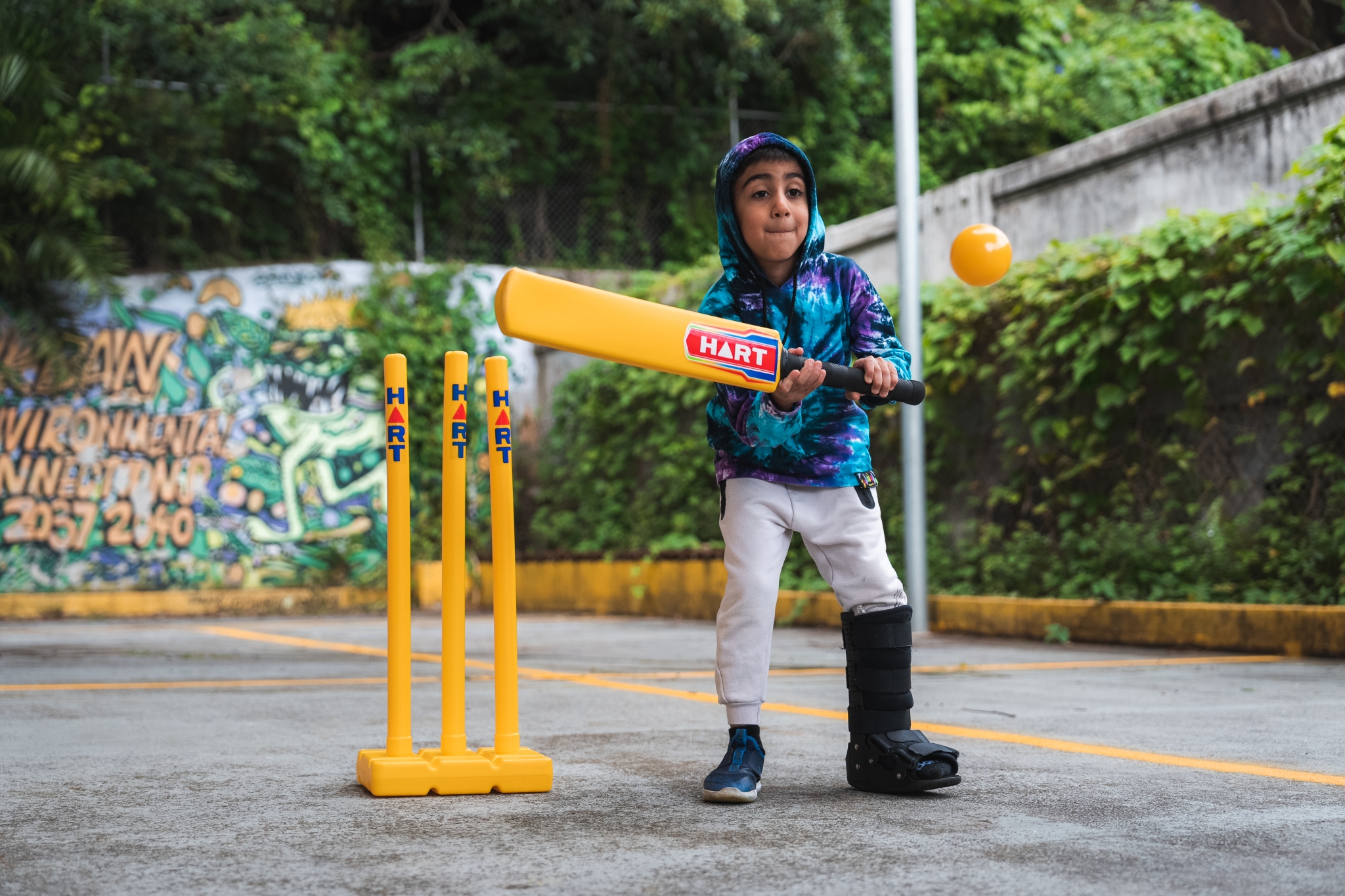 Child playing Cricket at PCYC School Holiday Program