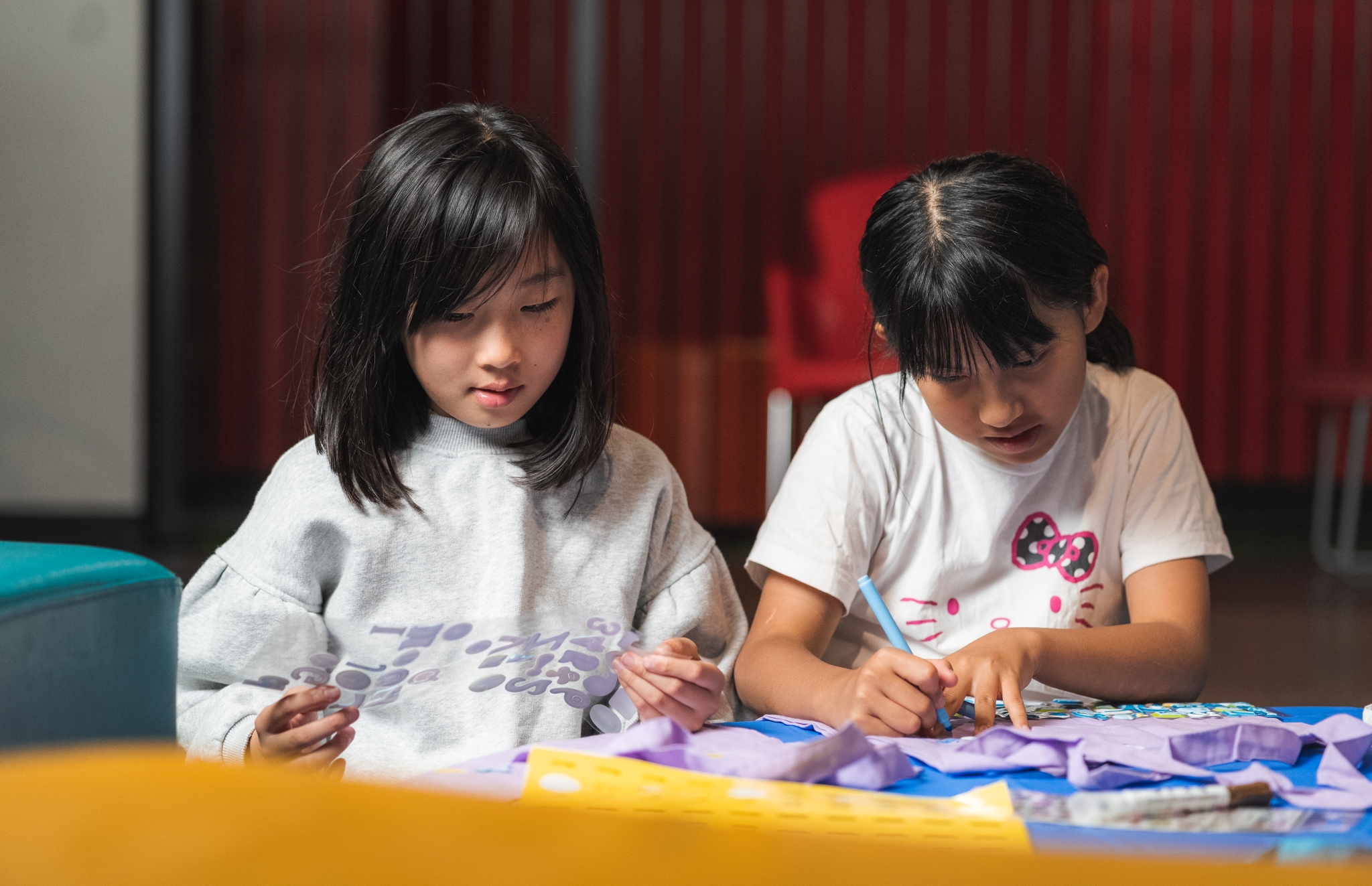Kids doing art during school holiday program