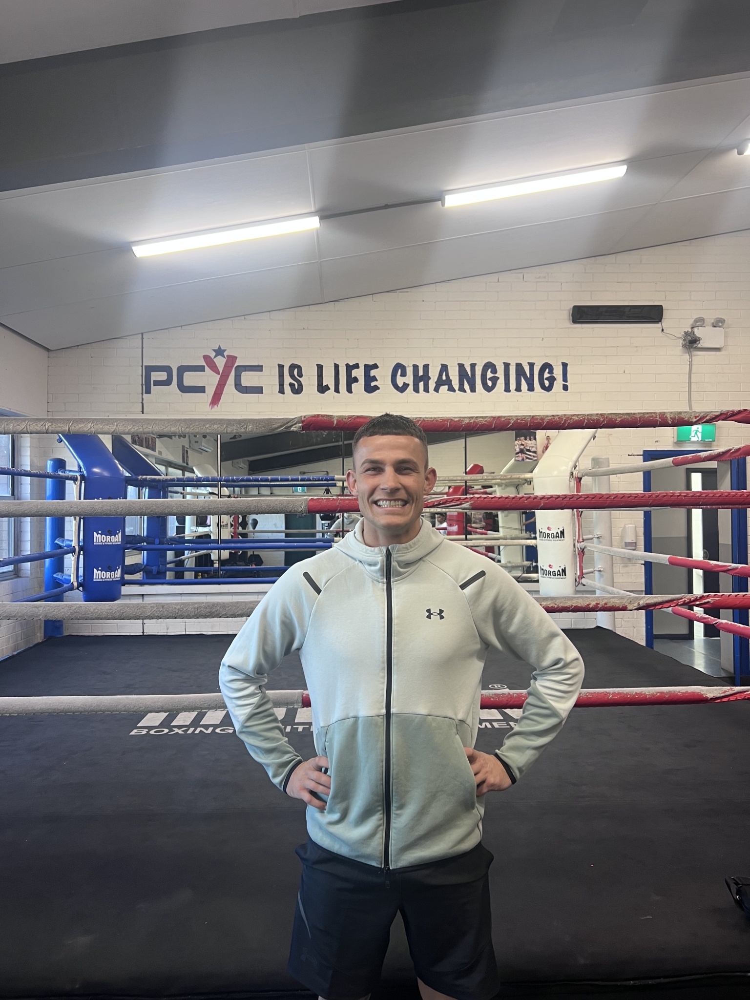 Olympic boxer, Harry Garside standing in front of PCYC boxing gym