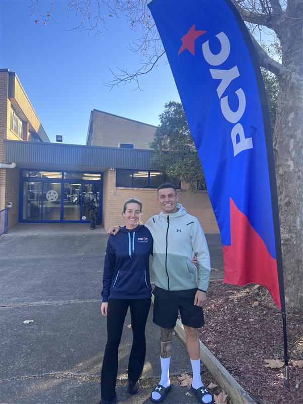 Olympic boxer, Harry Garside standing in front of PCYC Eastern Suburbs